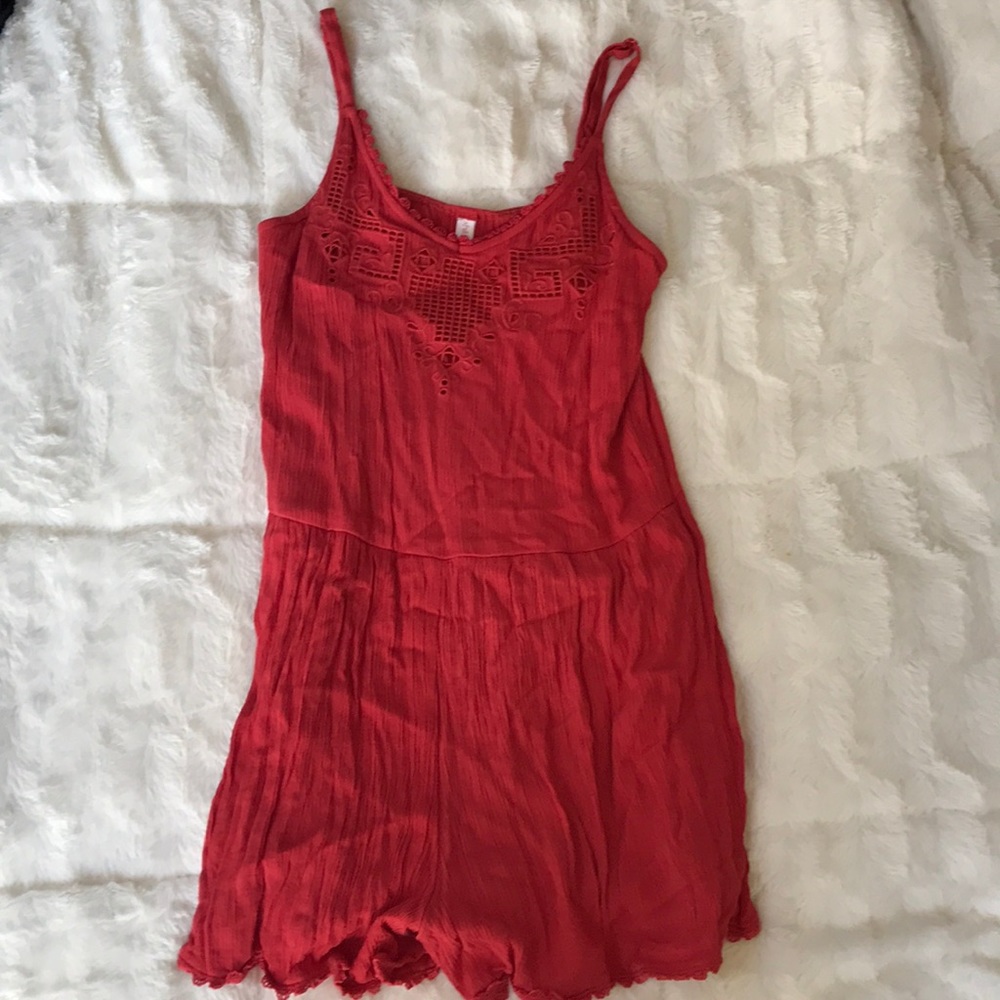 Red romper with detailing and lace